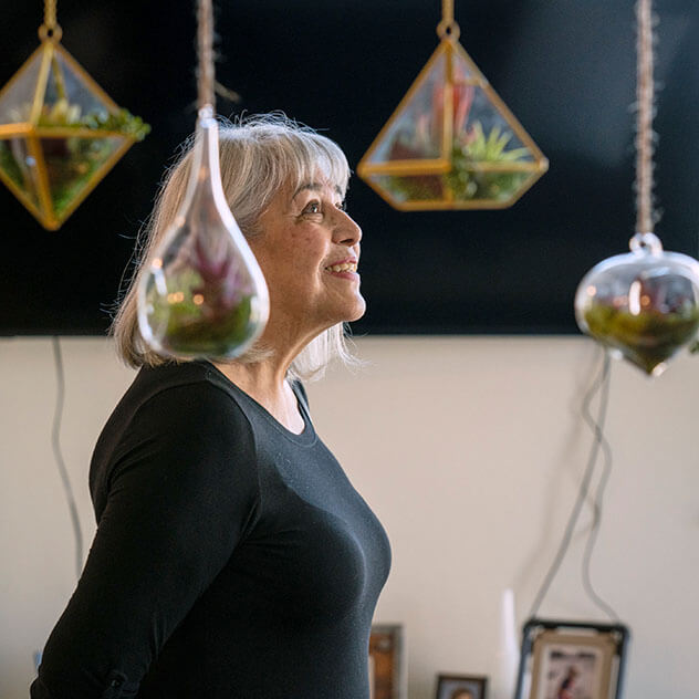 Woman standing with planters